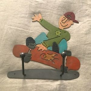 Metal skateboarder wall decor and hooks